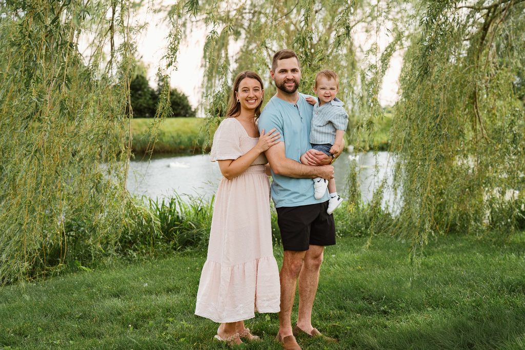 Adam Bruce holds Jaxson as Alyssa stands beside them