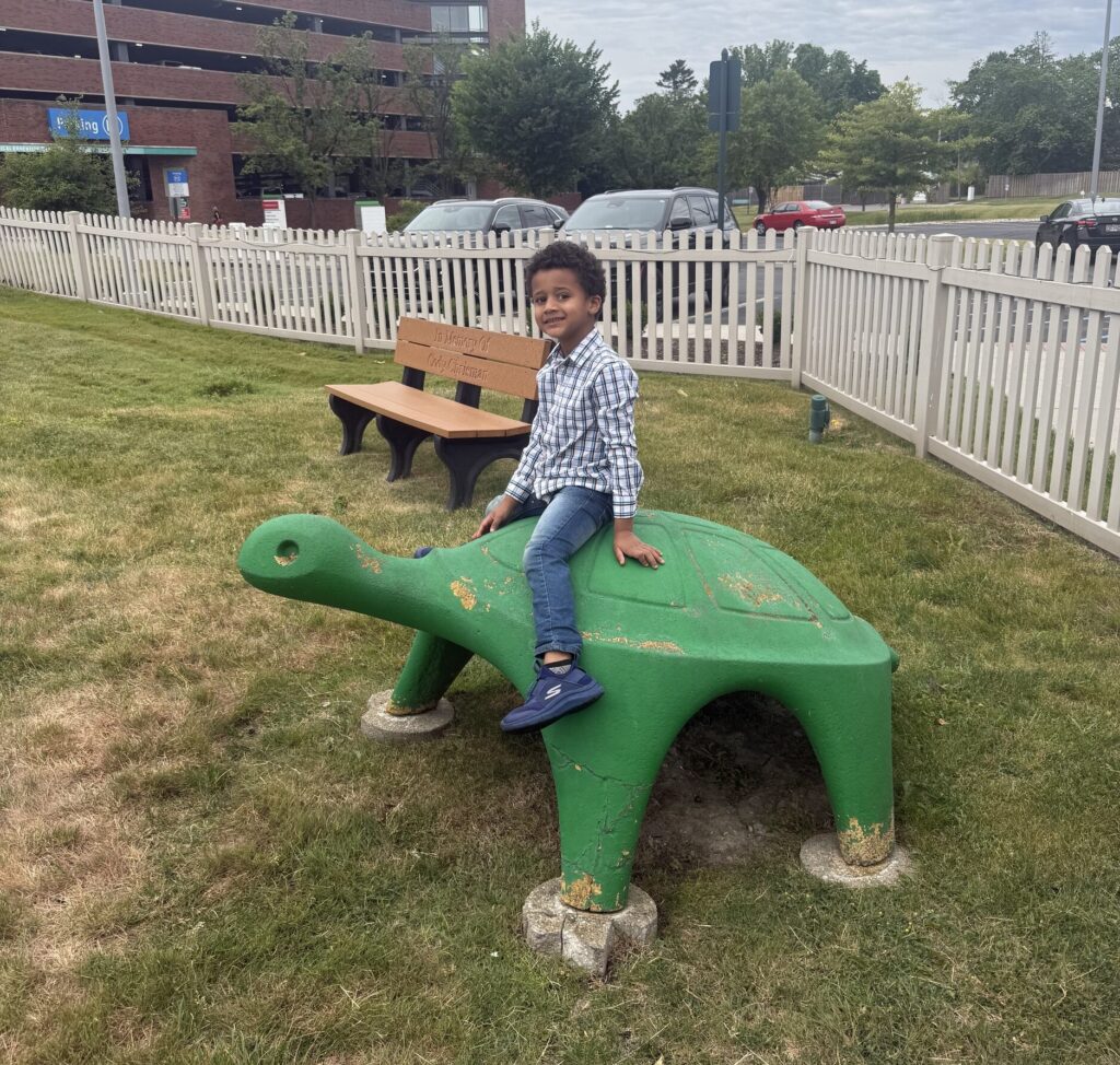 Jakob McMillan plays outside Ronald McDonald House Northwest Ohio