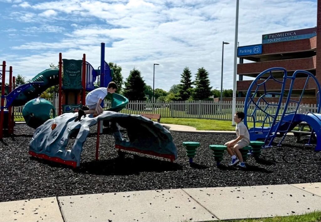 Carter and Colton Stephens play on the playground at Ronald McDonald House Northwest Ohio